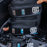 Stack of black StreamZ coolboots with brand logos held in cold water.